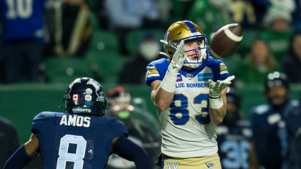 Nov 20, 2022; Regina, Saskatchewan, CAN; Toronto Argonauts defensive back DaShaun Amos (8) looks on as Winnipeg Blue Bombers receiver Dalton Schoen (83) makes a catch during the first half at Mosaic Stadium. Mandatory Credit: Bob Frid-USA TODAY Sports  